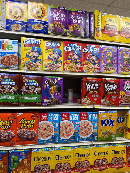 Cereal aisle at Latino American Fresh with Cheerios, Cap'n Crunch, Kix and more
